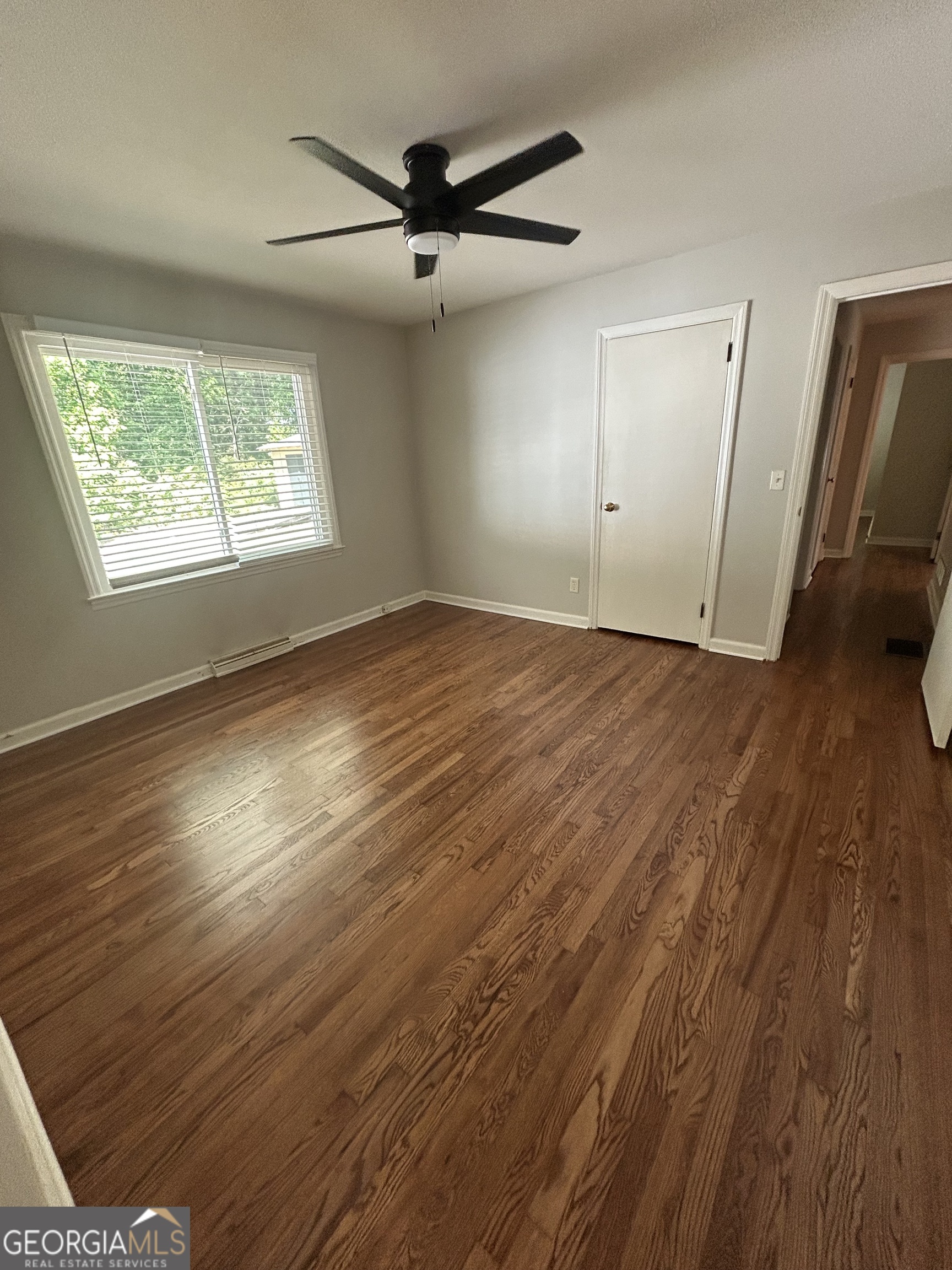 2 Ford Road Southeast Rome, GA 30161 - Photo 12 of 19 an empty room with wooden floor fan and windows