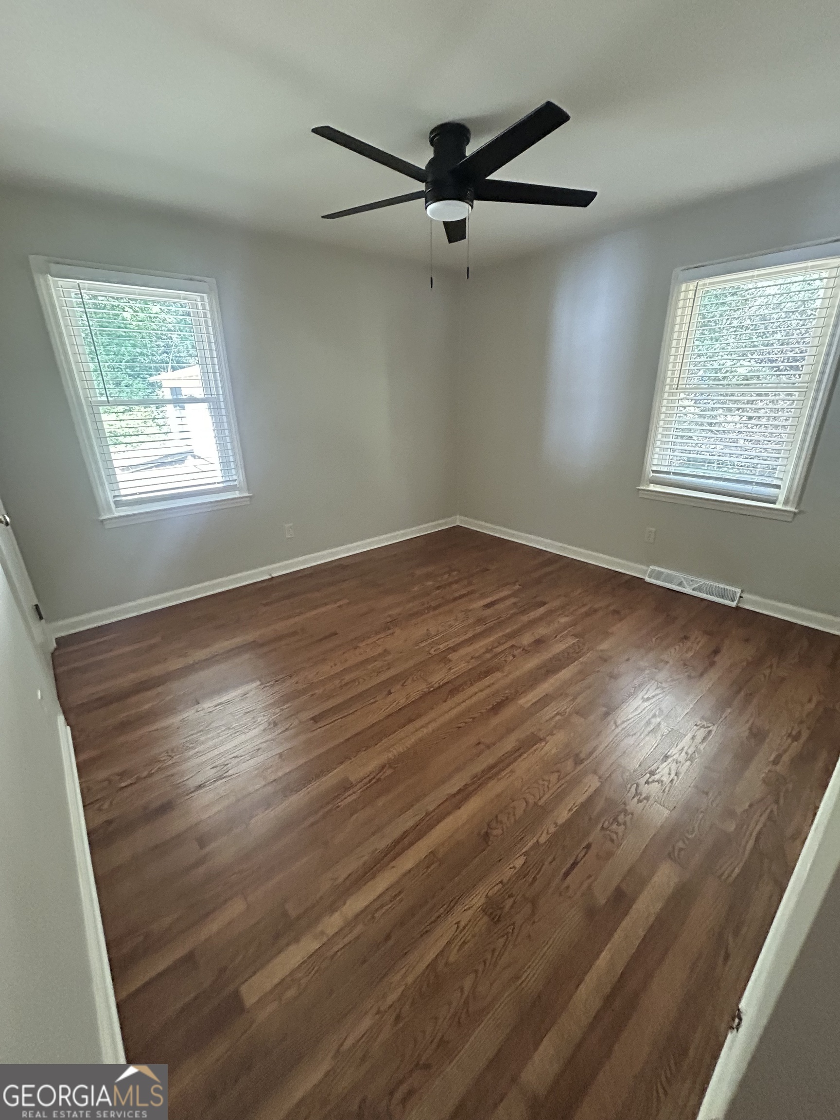 2 Ford Road Southeast Rome, GA 30161 - Photo 14 of 19 a view of an empty room with wooden floor and a window