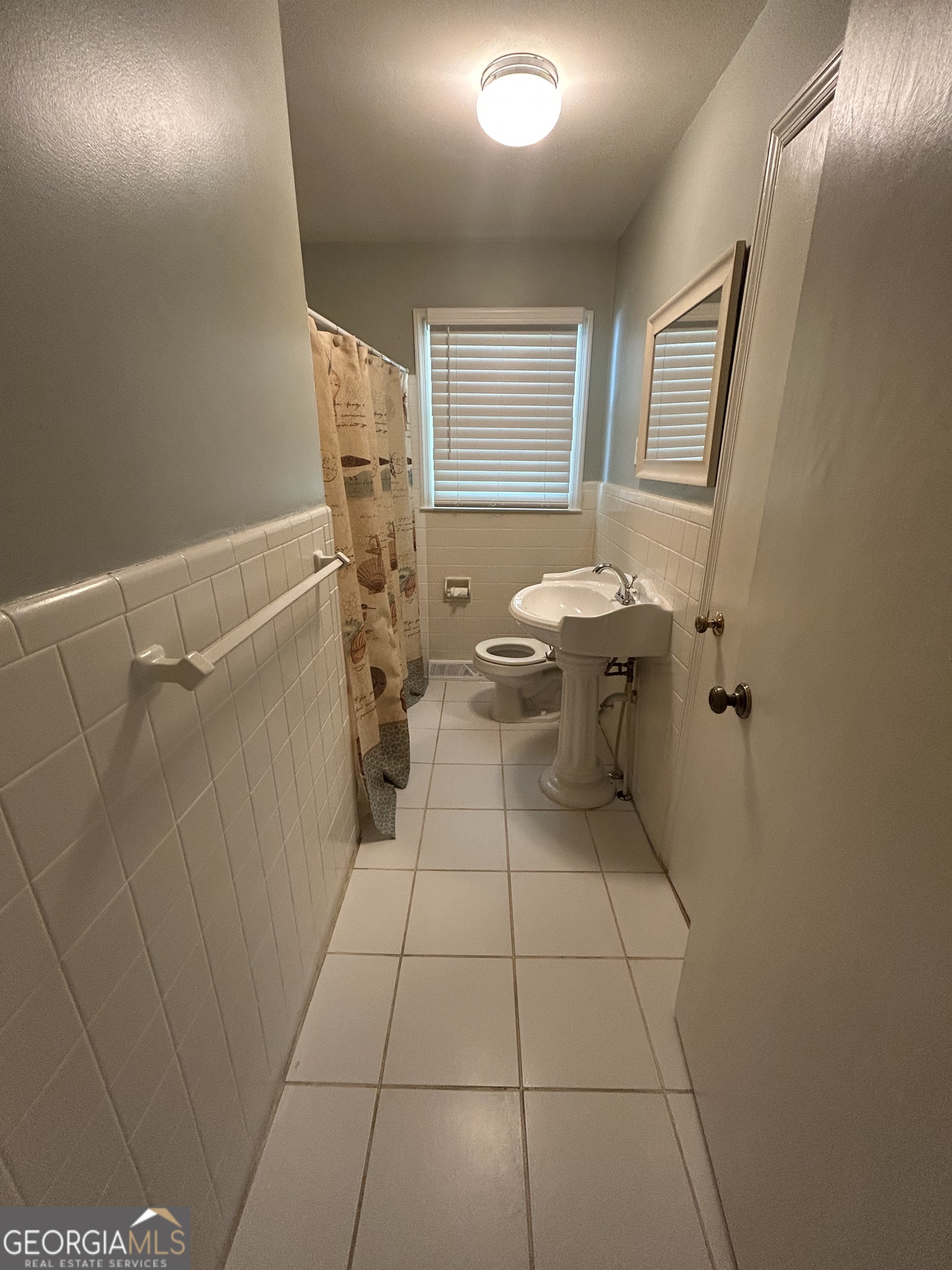 2 Ford Road Southeast Rome, GA 30161 - Photo 16 of 19 a bathroom with a sink toilet and shower