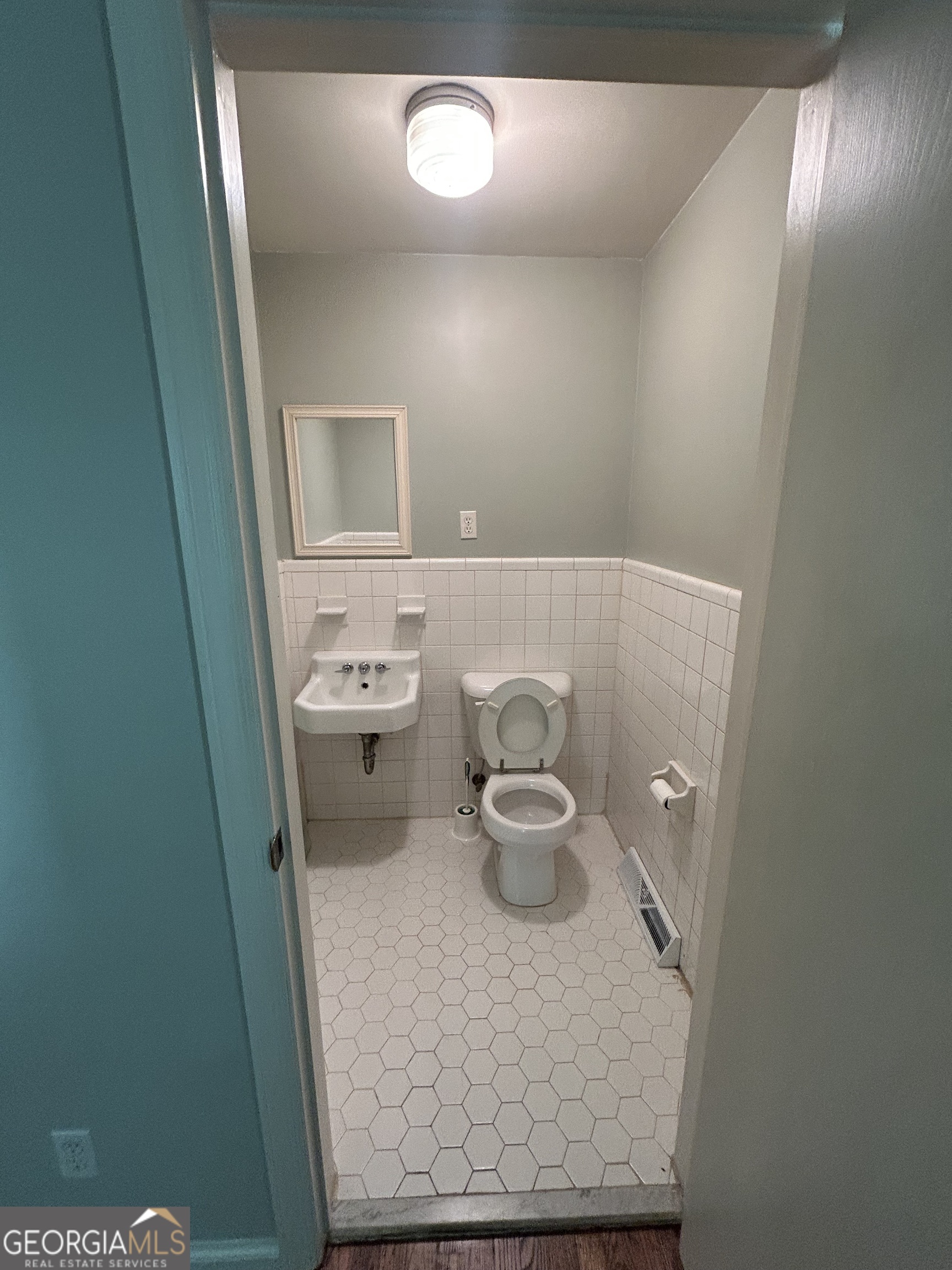 2 Ford Road Southeast Rome, GA 30161 - Photo 17 of 19 a bathroom with a granite countertop sink and a toilet