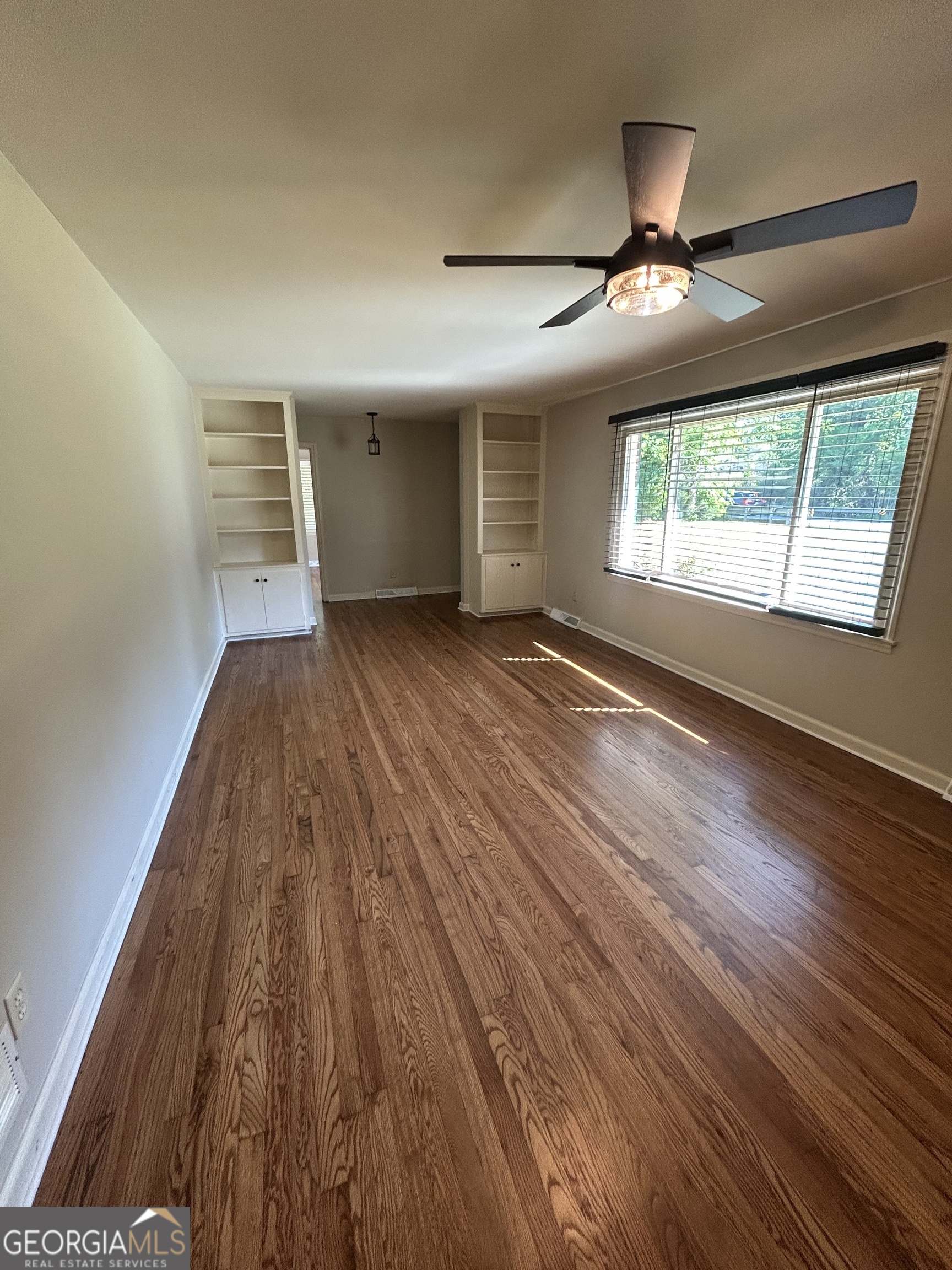 2 Ford Road Southeast Rome, GA 30161 - Photo 3 of 19 wooden floor in an empty room with a window