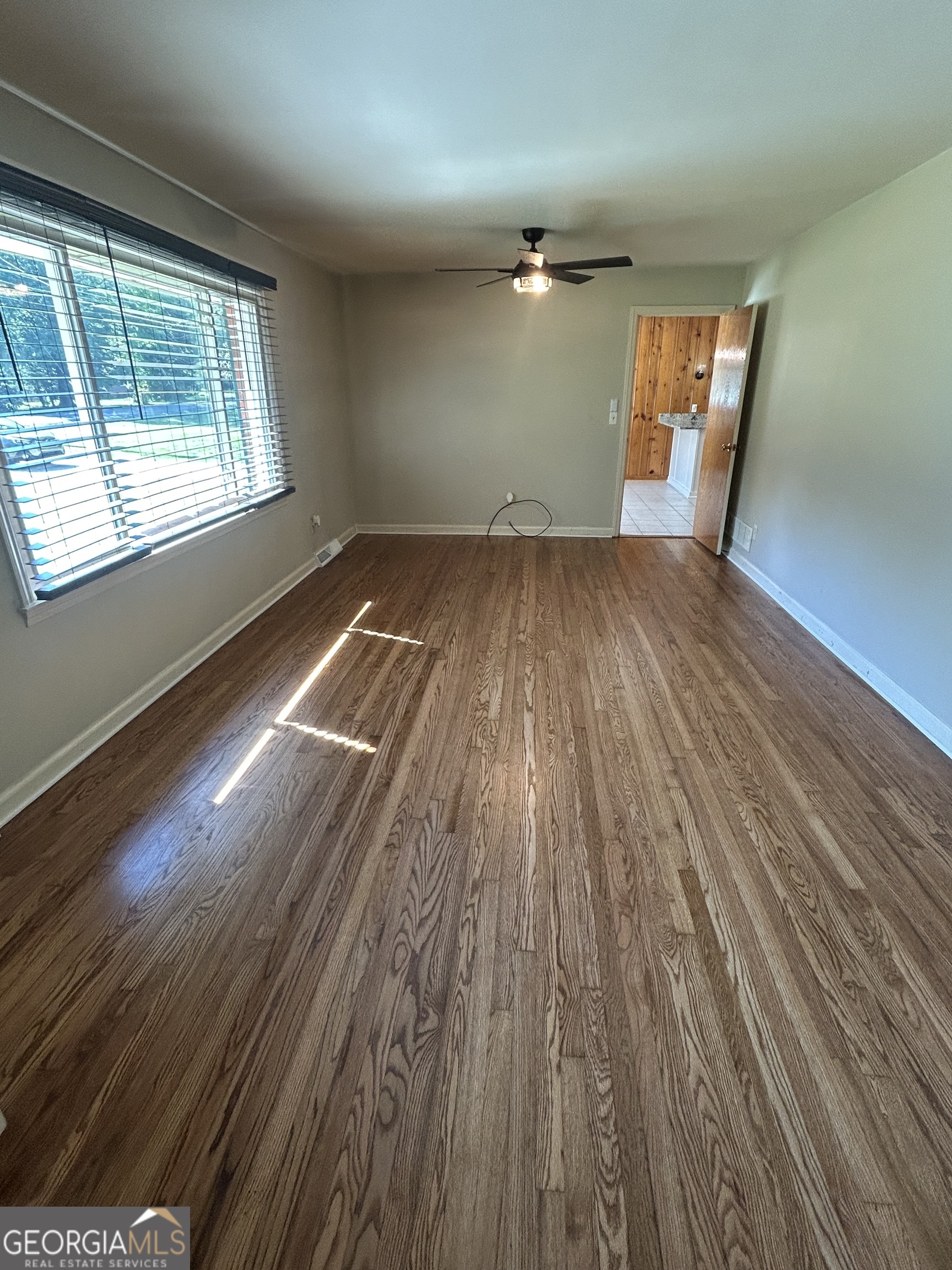 2 Ford Road Southeast Rome, GA 30161 - Photo 4 of 19 wooden floor in an empty room with a window