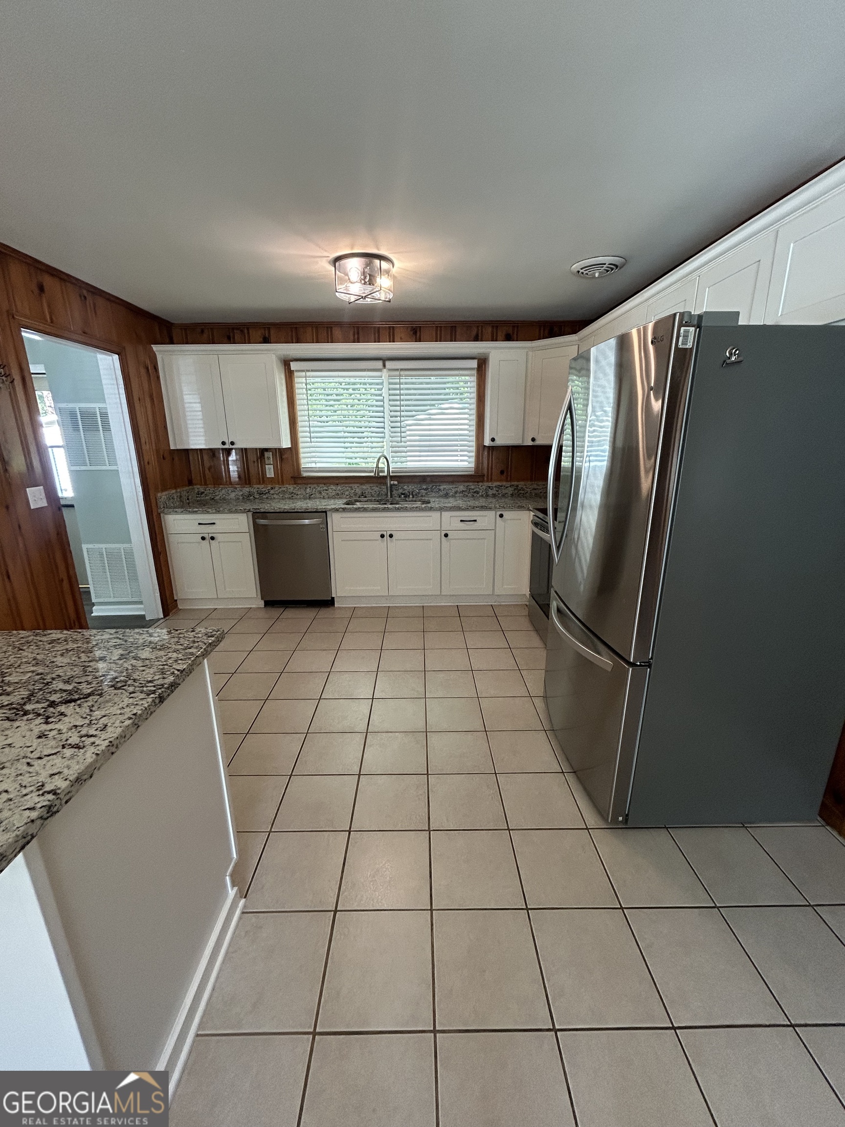 2 Ford Road Southeast Rome, GA 30161 - Photo 6 of 19 a kitchen with stainless steel appliances a refrigerator sink and microwave