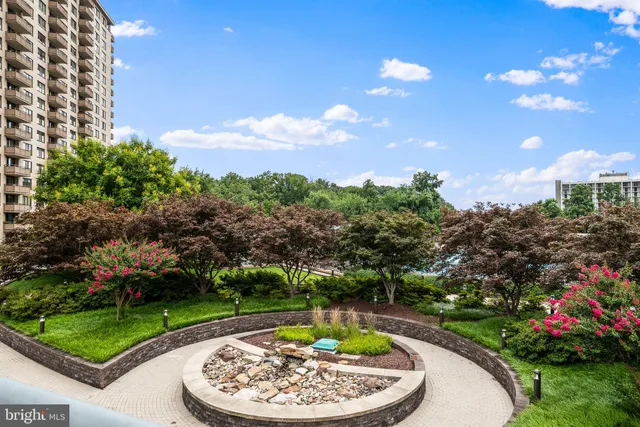 a view of a swimming pool with a yard