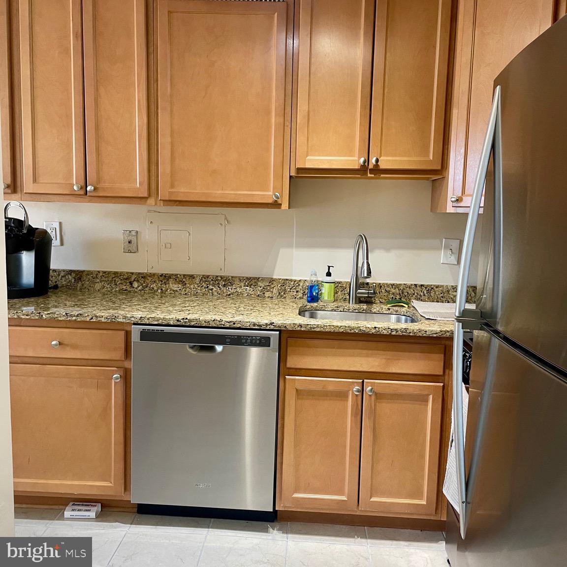 5225 Pooks Hill Road, Unit 1607N Bethesda, MD 20814 - Photo 3 of 51 a kitchen with granite countertop cabinets stainless steel appliances and a counter space
