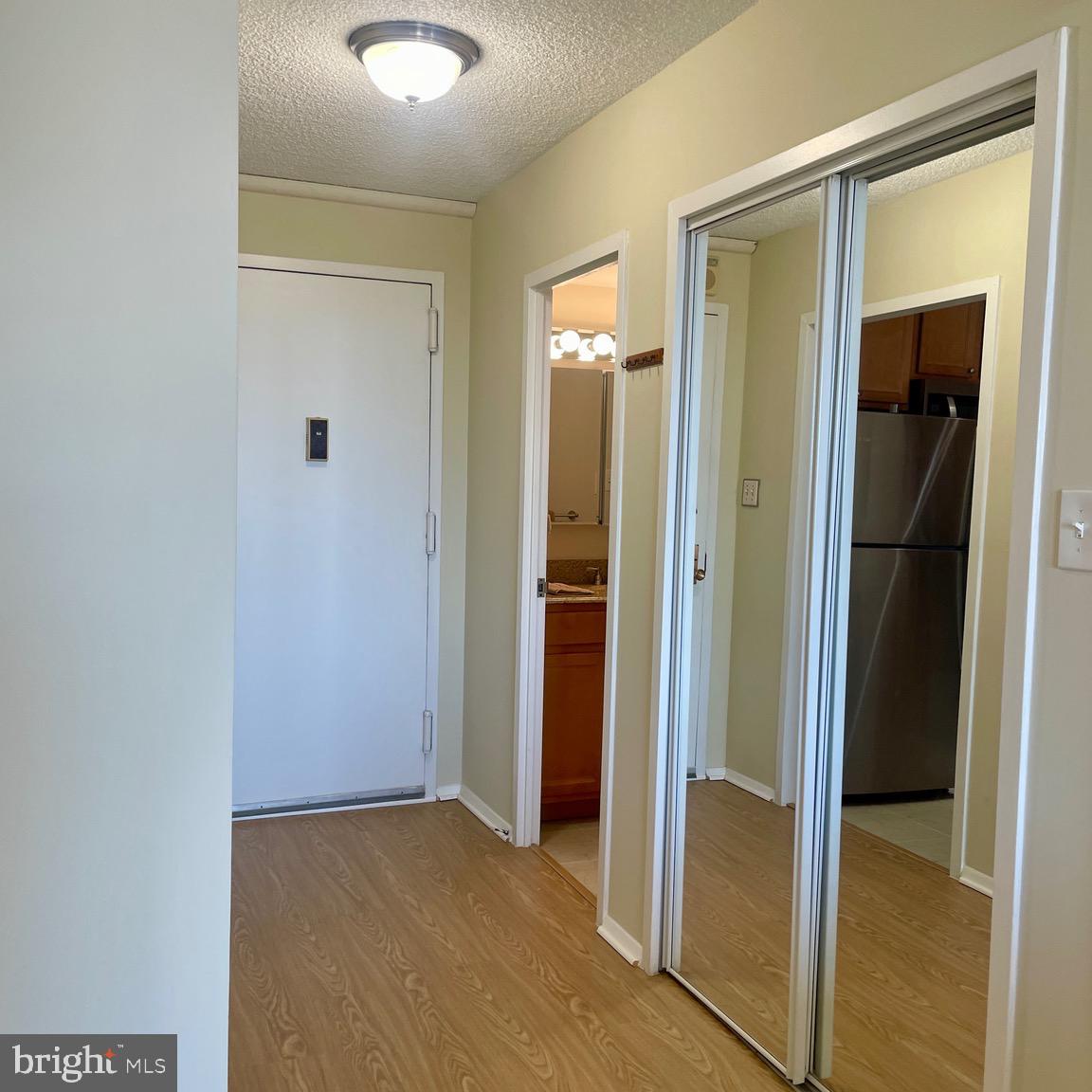 5225 Pooks Hill Road, Unit 1607N Bethesda, MD 20814 - Photo 5 of 51 wooden floor and closet in a room