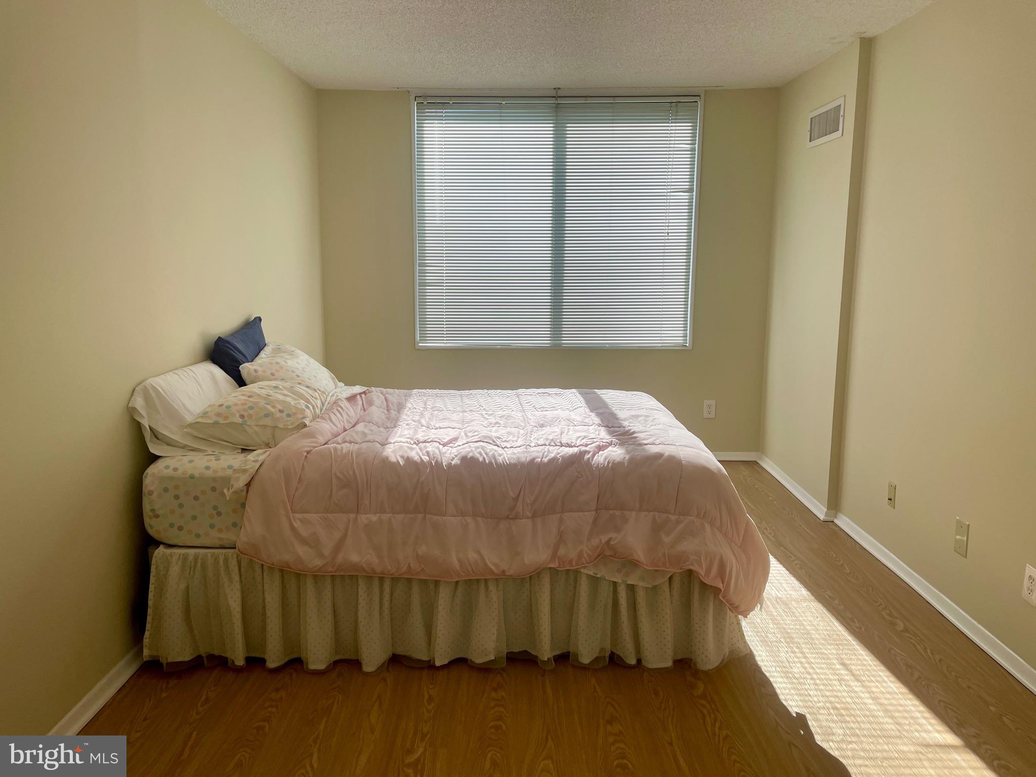 5225 Pooks Hill Road, Unit 1607N Bethesda, MD 20814 - Photo 6 of 51 a bedroom with a bed and a window