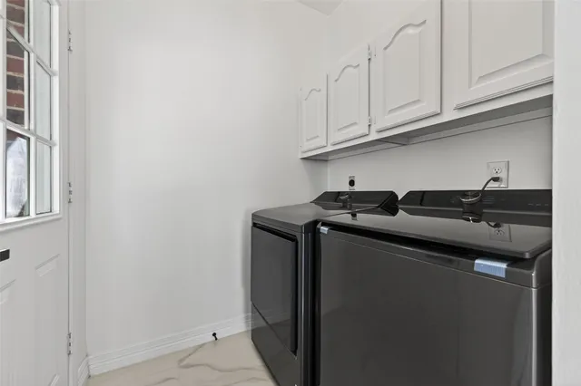 a bathroom with a sink a large mirror and a bathtub
