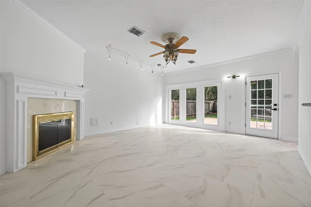 a kitchen with stainless steel appliances granite countertop a refrigerator a stove and a sink