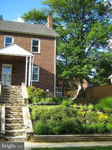645 Coleraine Road Baltimore, MD 21229 - Photo 11 of 28 a front view of a house with a yard