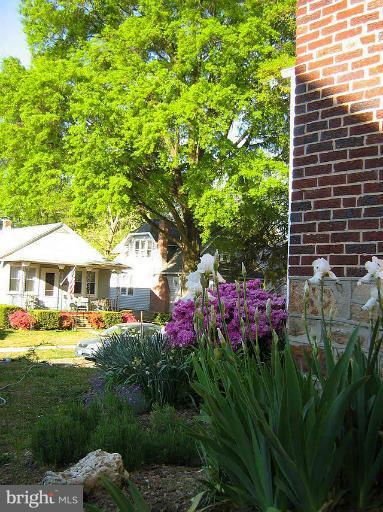 645 Coleraine Road Baltimore, MD 21229 - Photo 18 of 28 a view of a house with a yard and garden