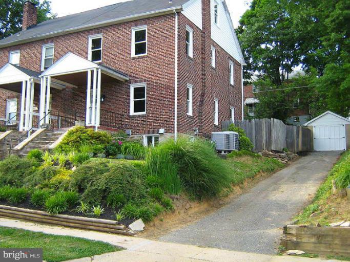 645 Coleraine Road Baltimore, MD 21229 - Photo 28 of 28 a front view of a house with a yard and garage