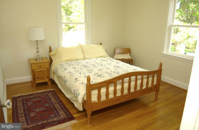 645 Coleraine Road Baltimore, MD 21229 - Photo 9 of 28 a bed sitting in a bedroom next to a window