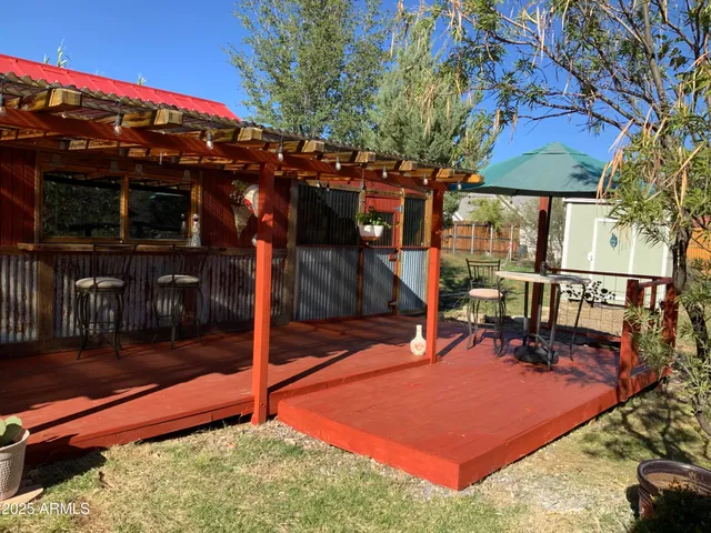 a view of a patio with chairs and table