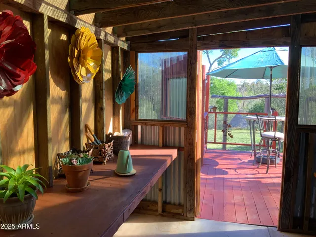 a view of entryway with furniture and wooden floor