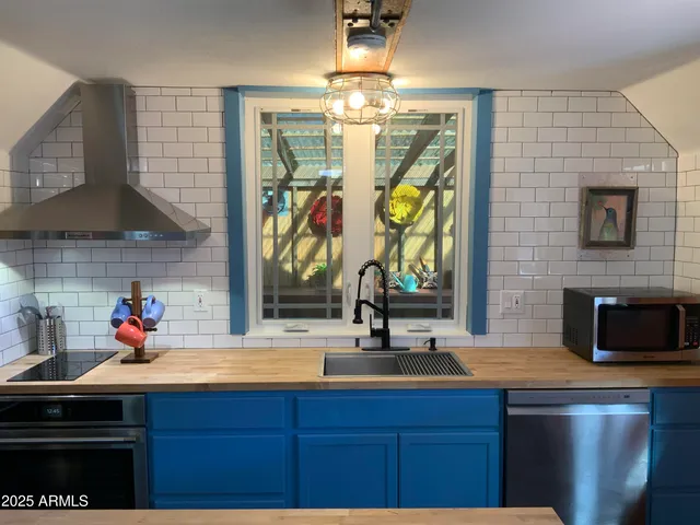 a kitchen with a sink and a microwave