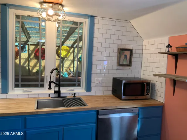 a bed room with a bed and a dresser