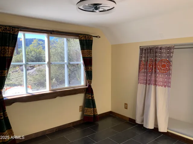 a view of a door and a window