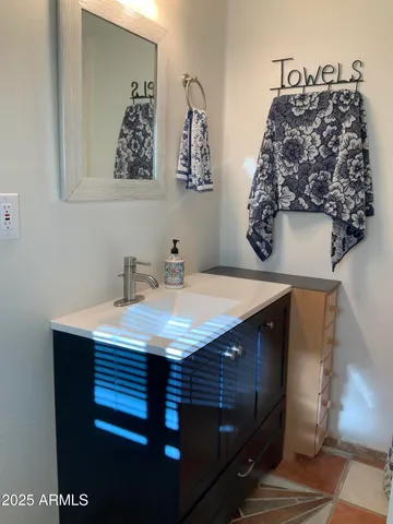 a view of a house with a yard and tree s