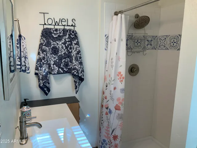 a kitchen with cabinets a refrigerator and a sink
