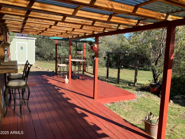 a view of a patio with a table and chairs