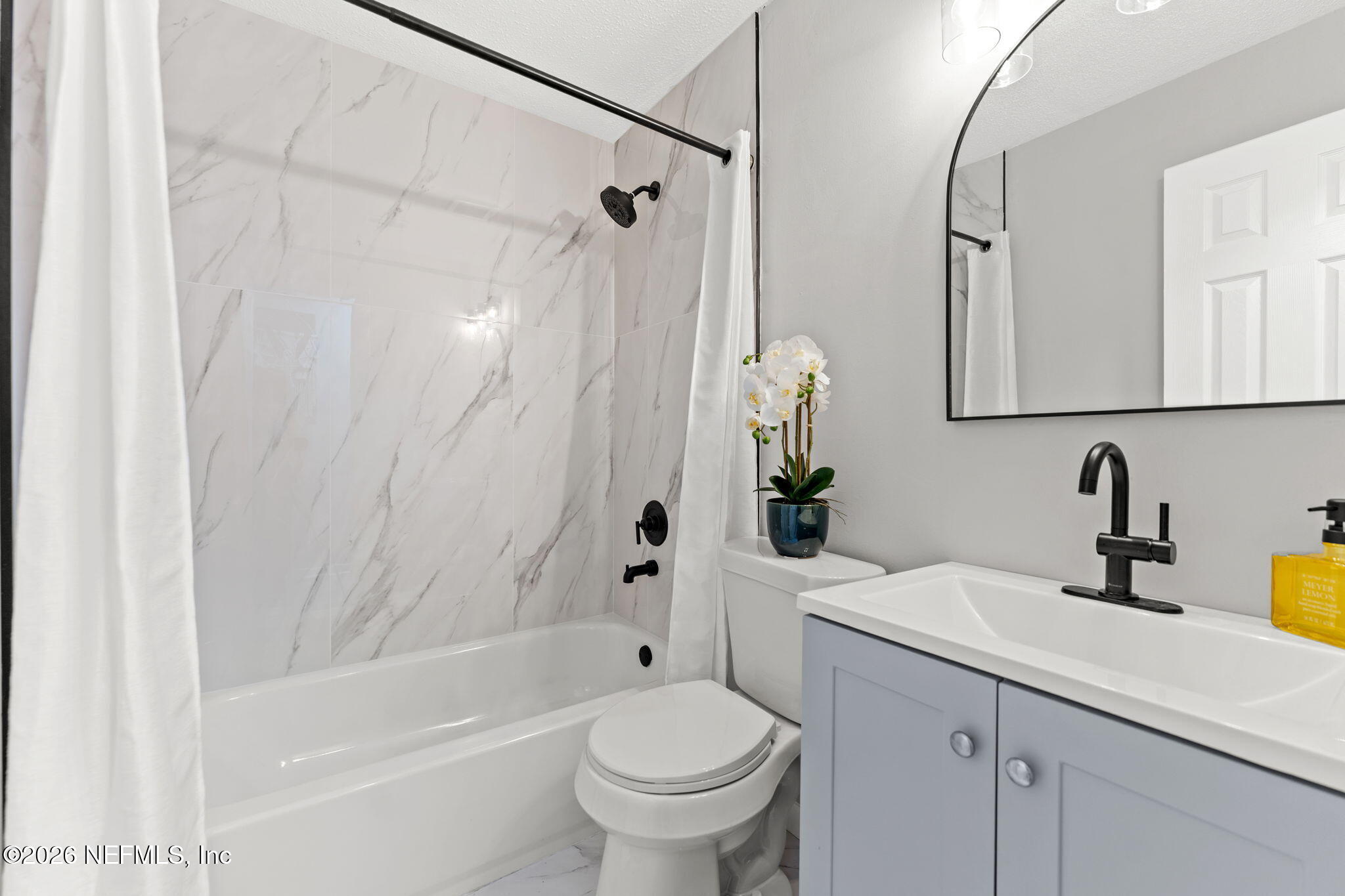 2455 Seaway Street Jacksonville, FL 32233 - Photo 12 of 16 a bathroom with a sink a toilet and a bathtub