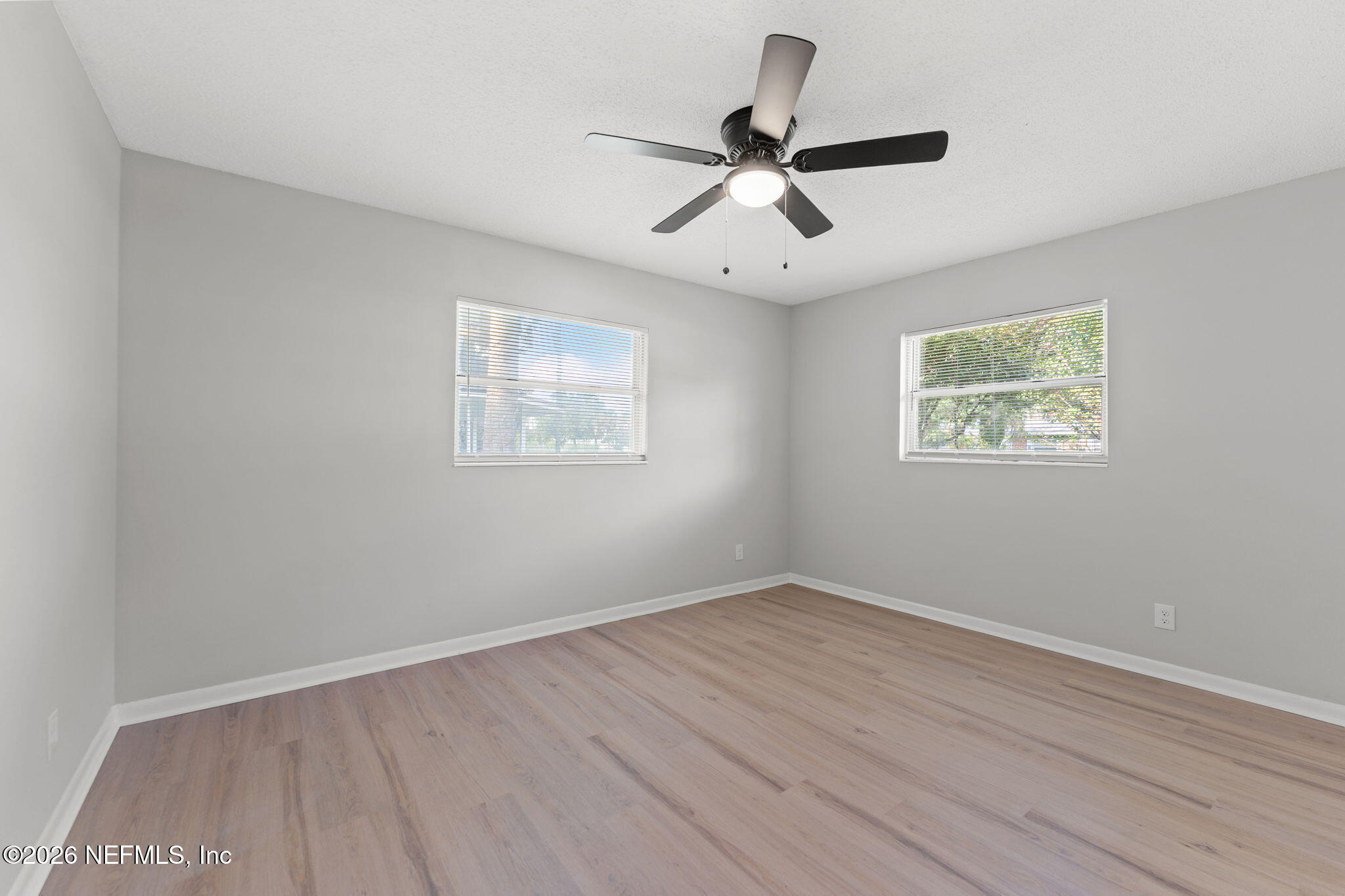 2455 Seaway Street Jacksonville, FL 32233 - Photo 13 of 16 a view of a big room with wooden floor and windows