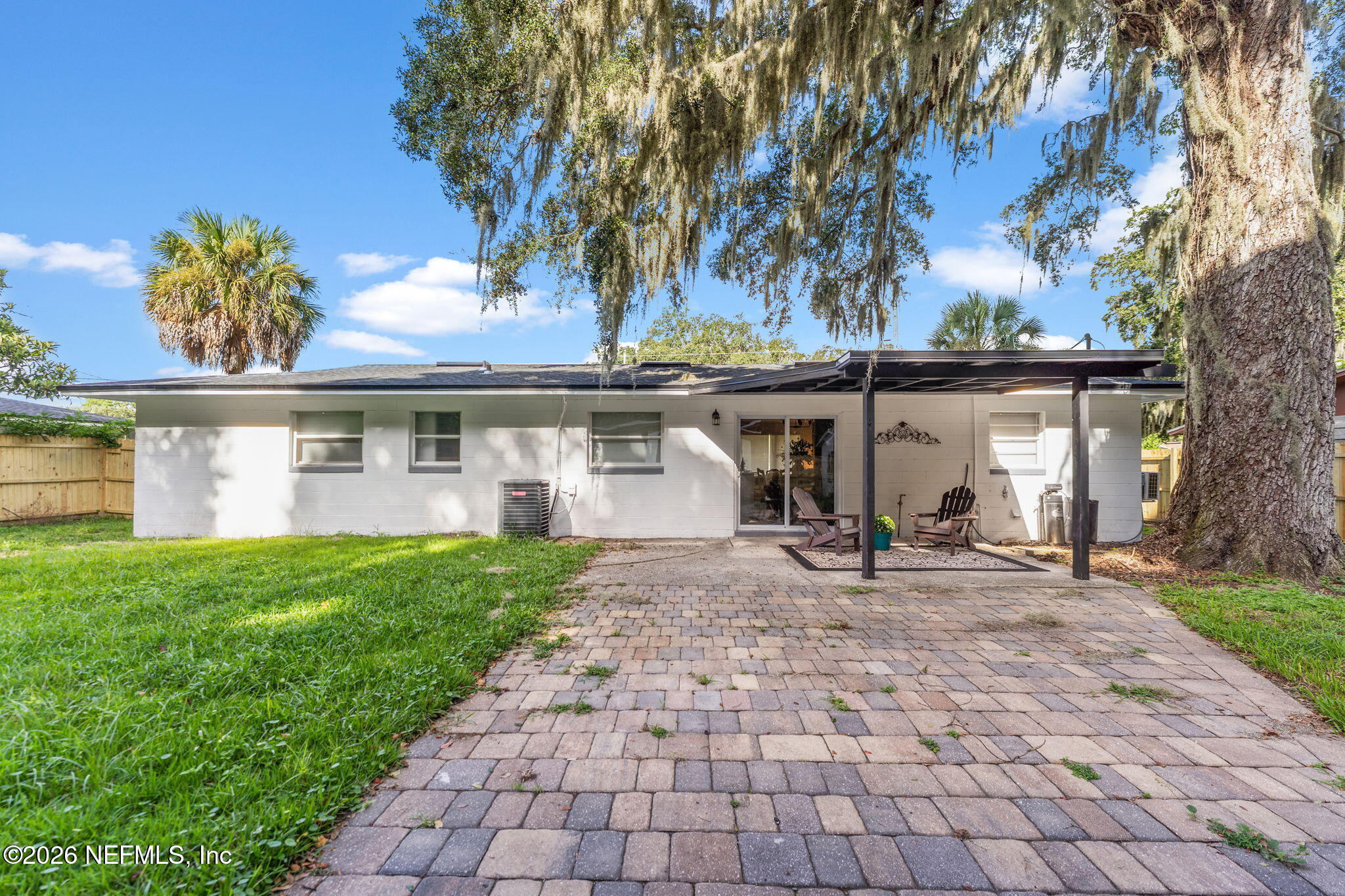 2455 Seaway Street Jacksonville, FL 32233 - Photo 16 of 16 a view of house with backyard and outdoor seating