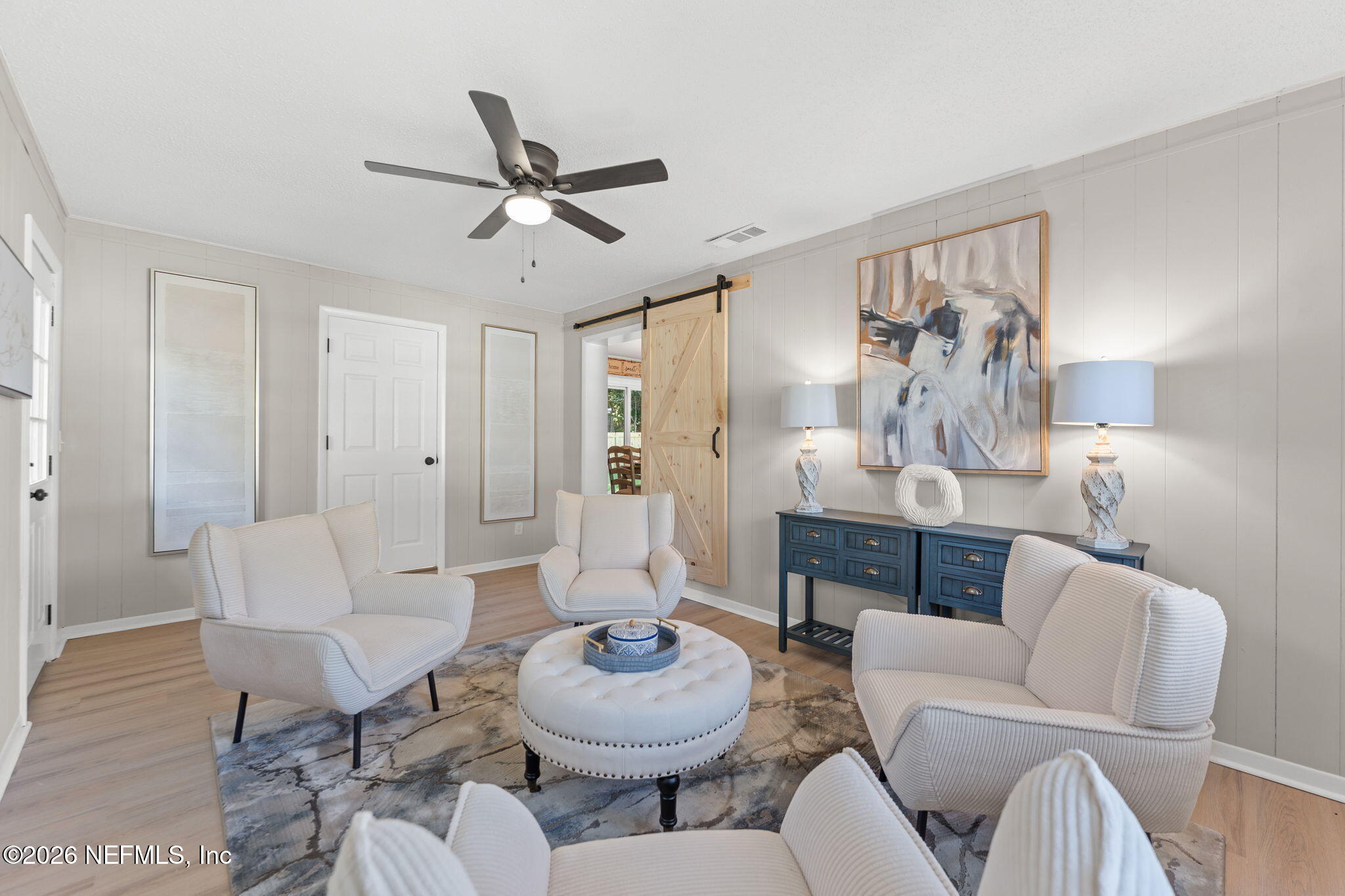 2455 Seaway Street Jacksonville, FL 32233 - Photo 7 of 16 a living room with furniture and a wooden floor