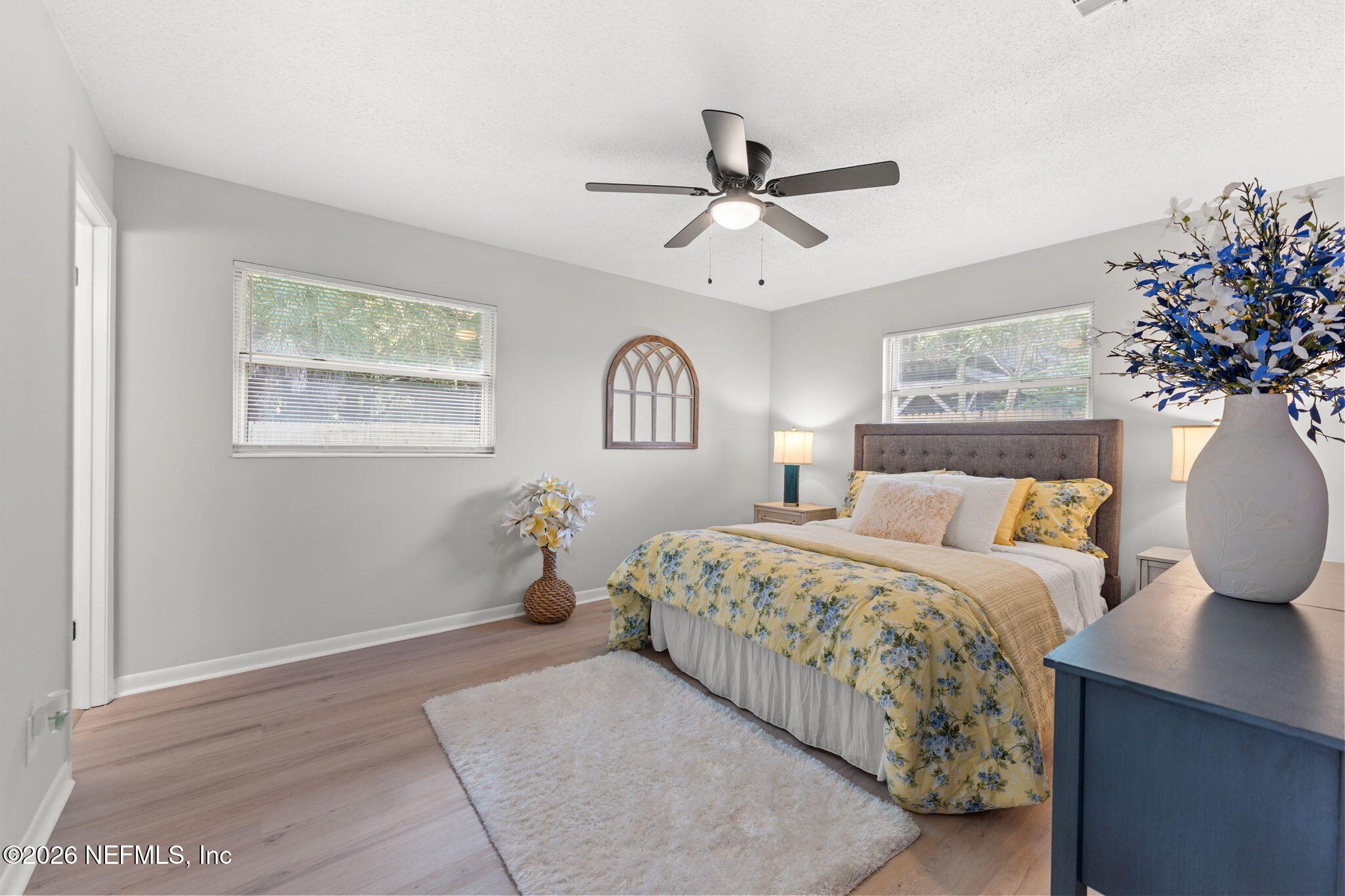 2455 Seaway Street Jacksonville, FL 32233 - Photo 8 of 16 a bedroom with a large bed and a chandelier