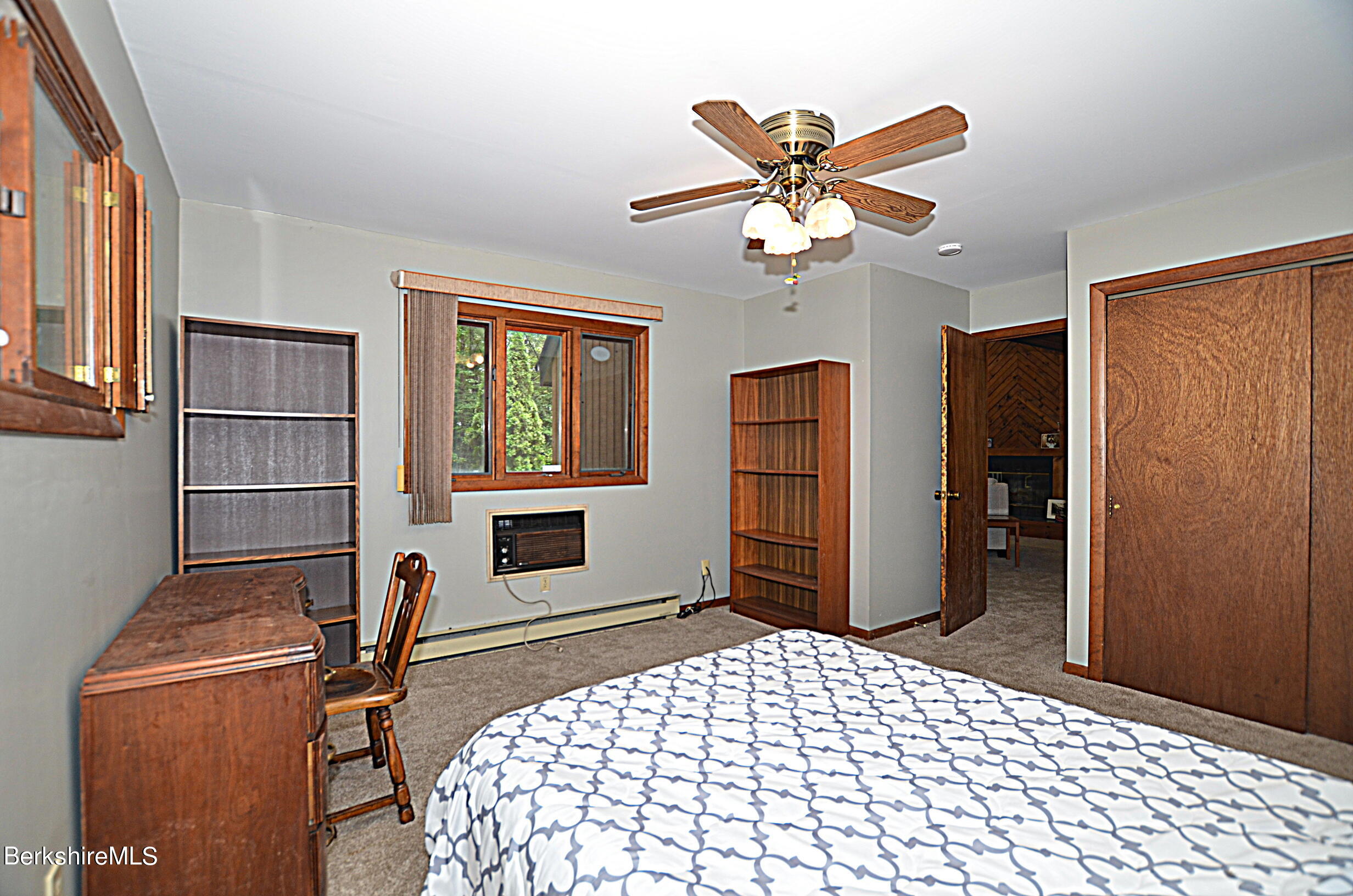 2477 West Center Road Otis, MA 01253 - Photo 18 of 31 a bedroom with a bed and a window