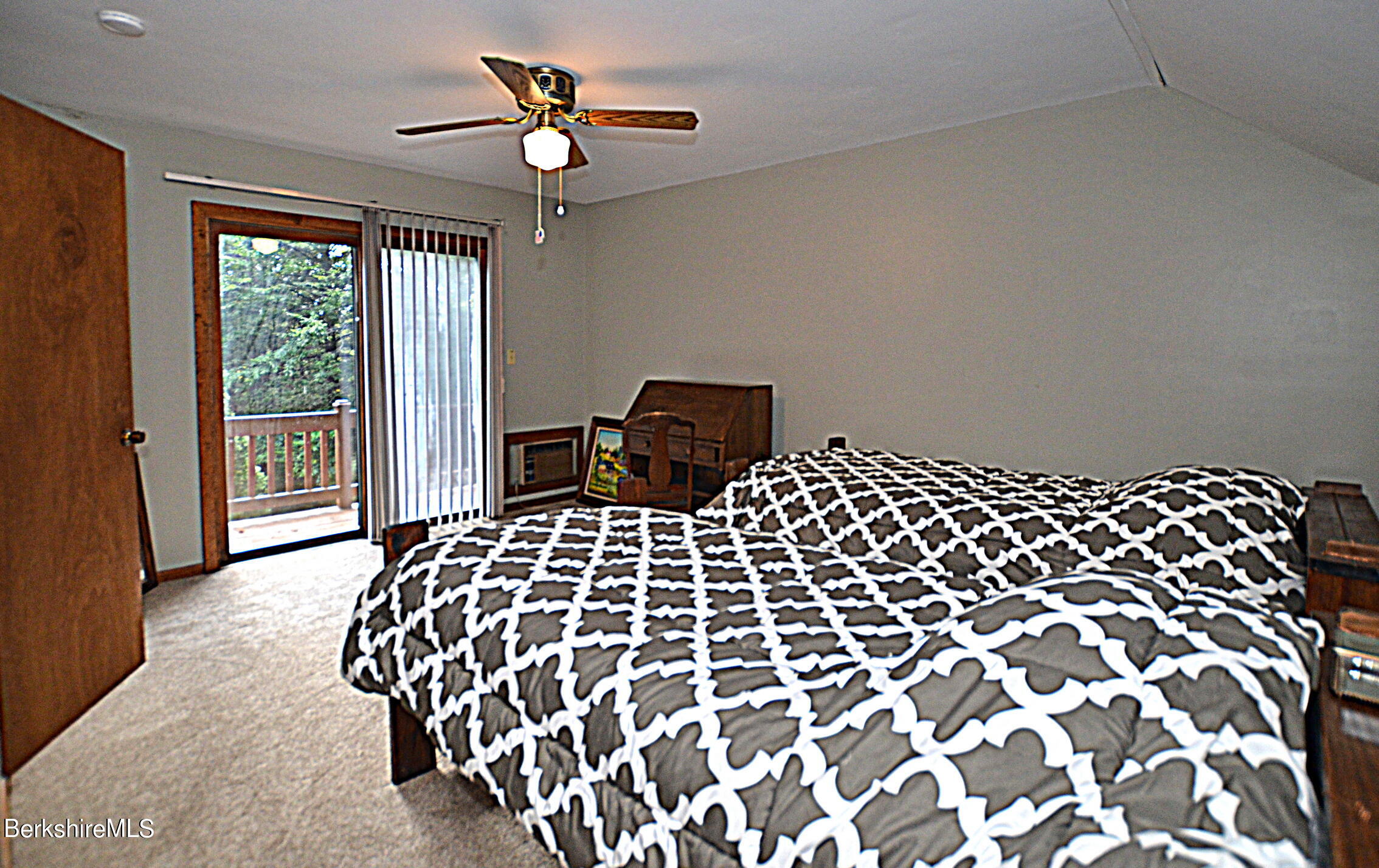 2477 West Center Road Otis, MA 01253 - Photo 20 of 31 a bedroom with a bed and a lamp