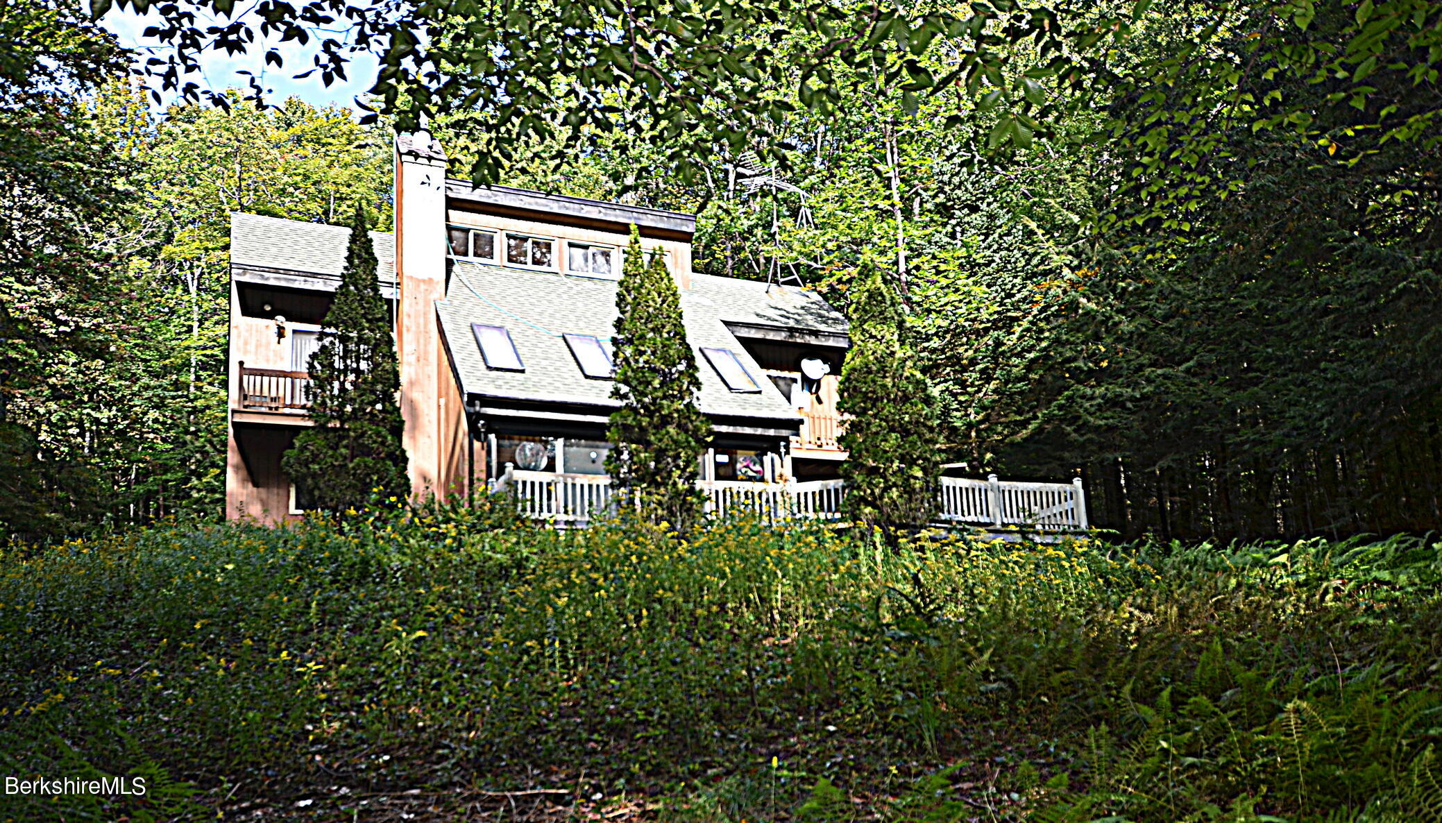 2477 West Center Road Otis, MA 01253 - Photo 2 of 31 an aerial view of a house with a yard