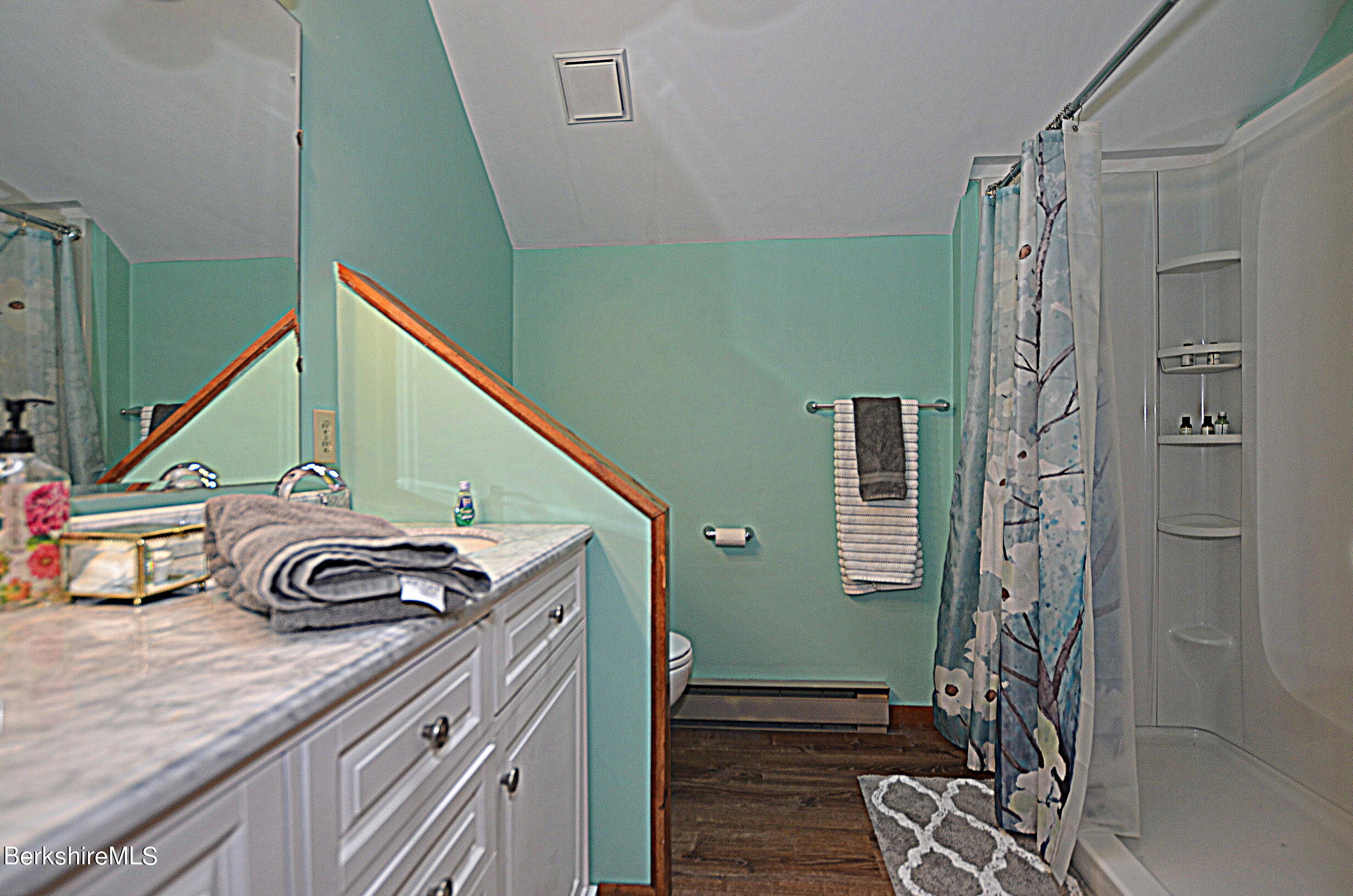 2477 West Center Road Otis, MA 01253 - Photo 21 of 31 a bathroom with a sink a toilet and shower