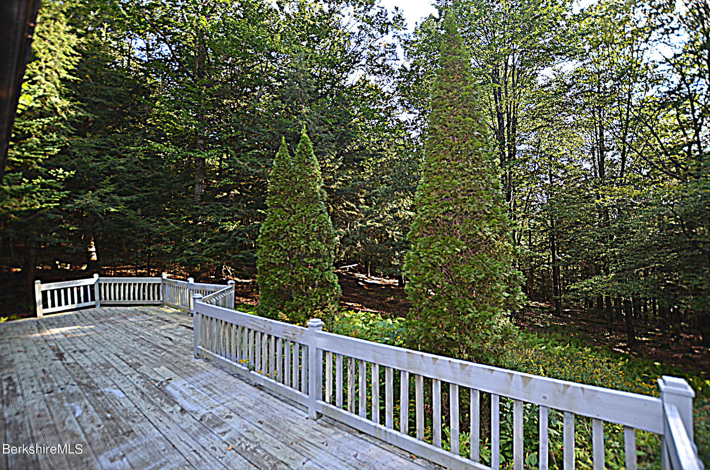 2477 West Center Road Otis, MA 01253 - Photo 28 of 31 a view of roof deck with wooden floor and fence