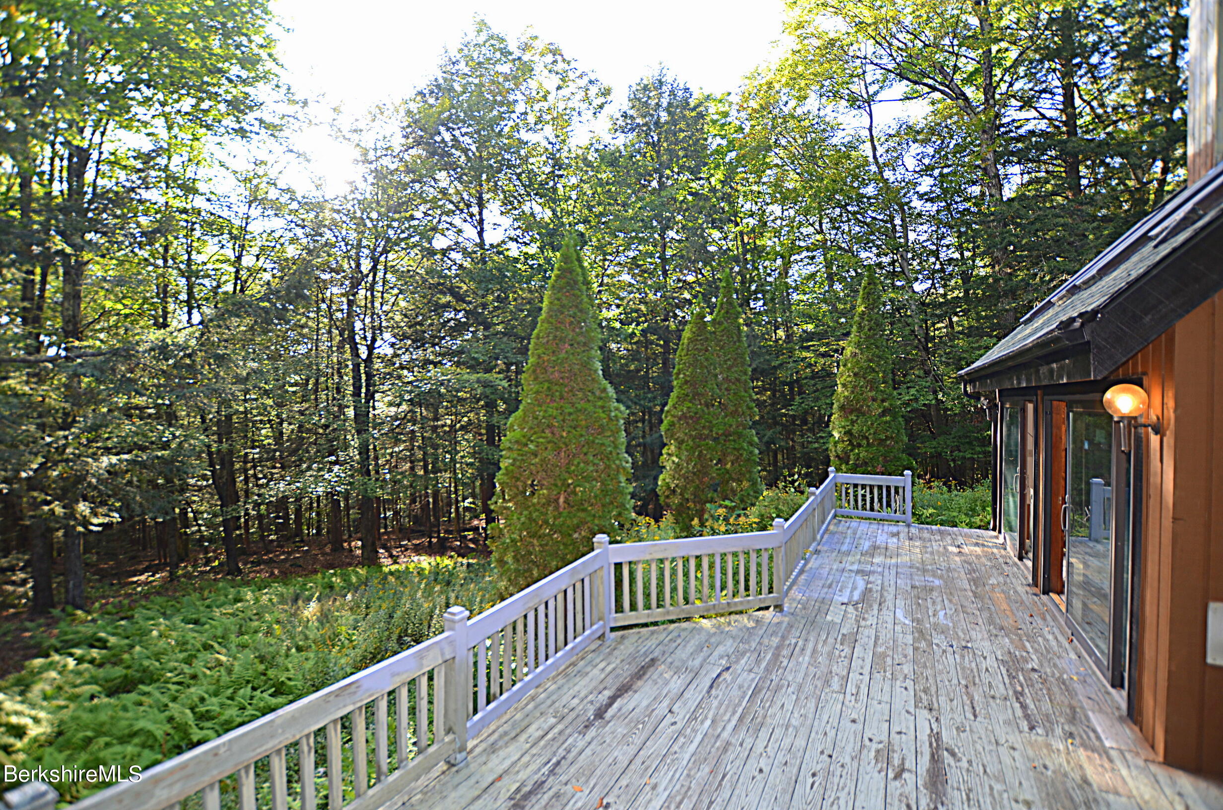 2477 West Center Road Otis, MA 01253 - Photo 29 of 31 a view of balcony with deck and trees