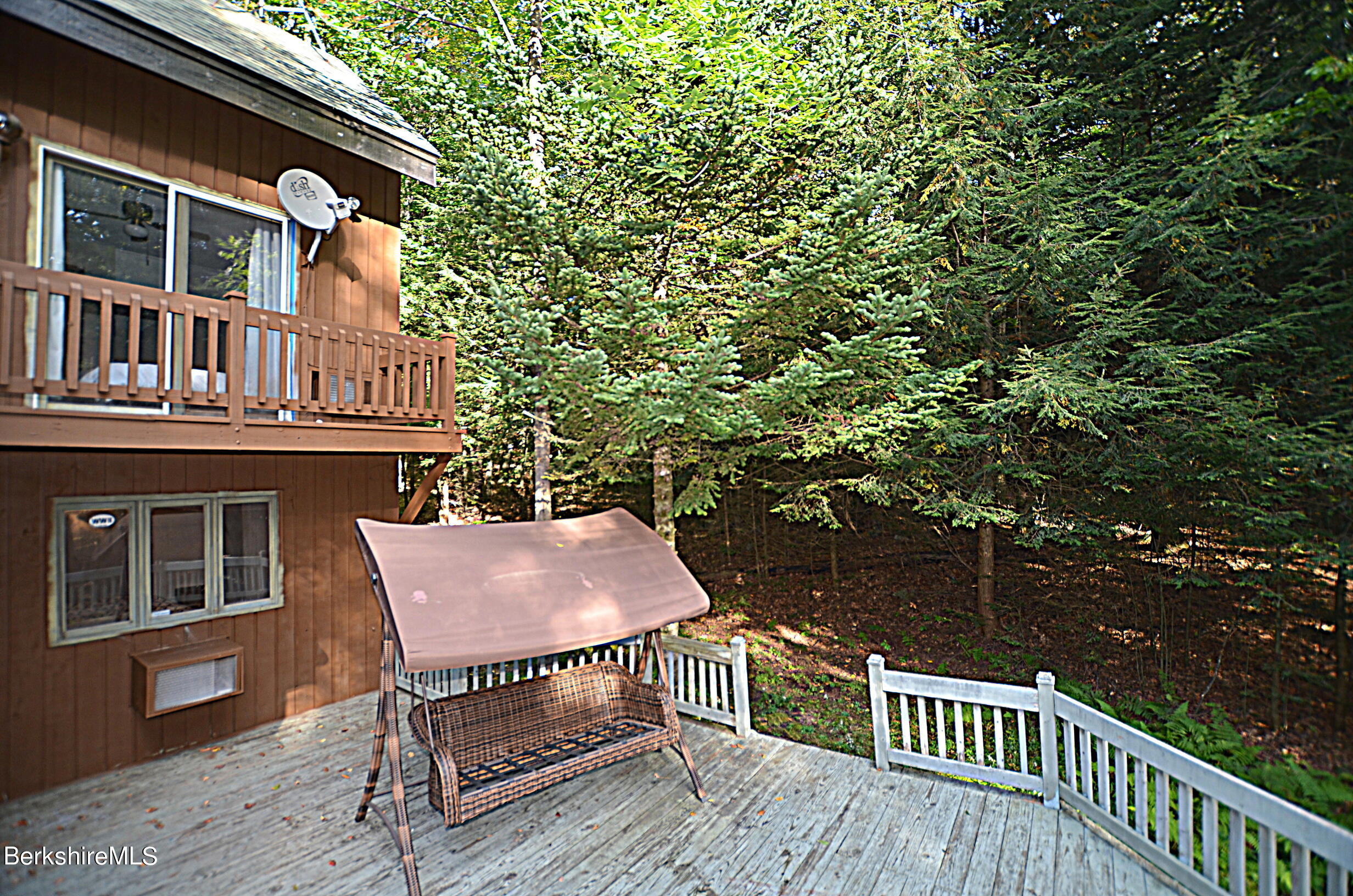 2477 West Center Road Otis, MA 01253 - Photo 30 of 31 a roof deck with table and chairs and wooden floor
