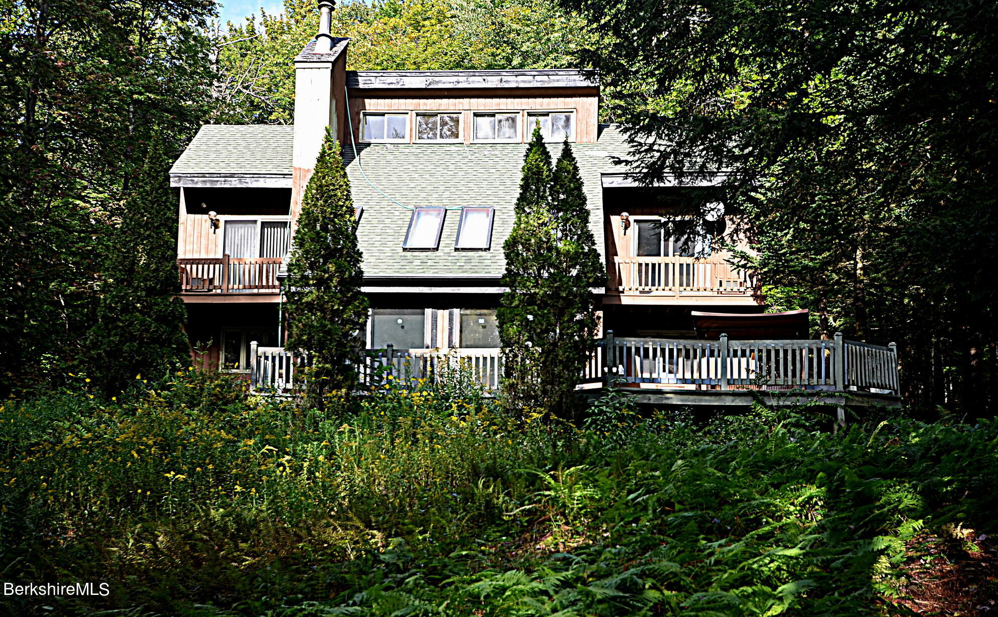 2477 West Center Road Otis, MA 01253 - Photo 5 of 31 a front view of a house with a yard