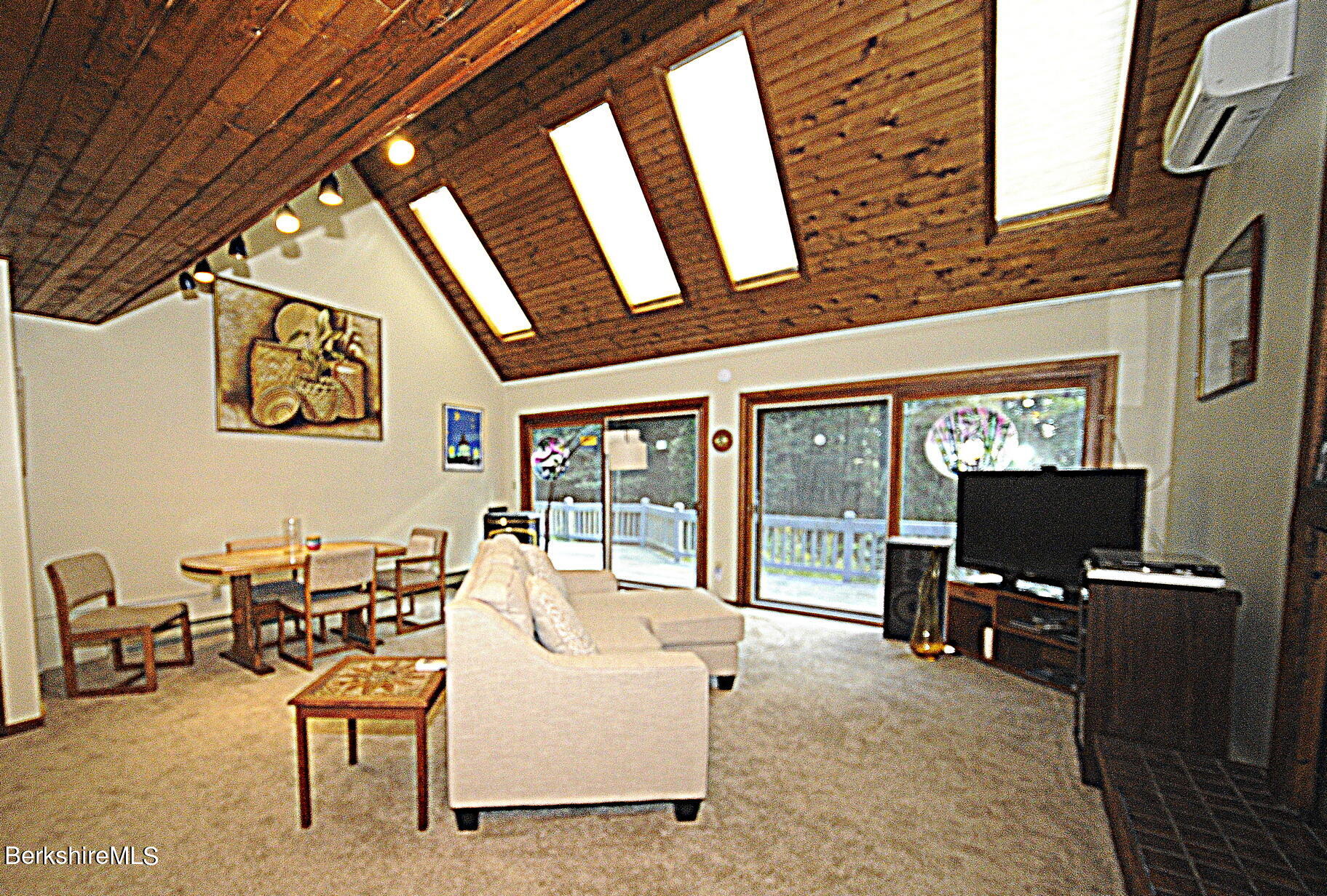 2477 West Center Road Otis, MA 01253 - Photo 8 of 31 a view of a chairs and table in a patio