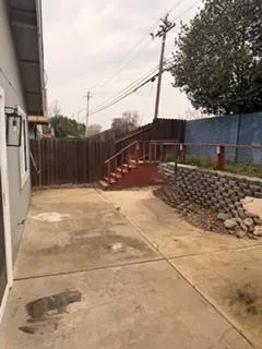 a street view with wooden fence