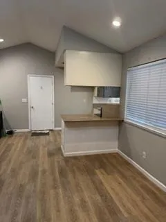 a view of a kitchen with a sink and a stove top oven