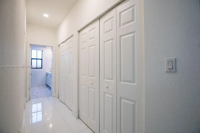 a bedroom with a bed and a walk in closet