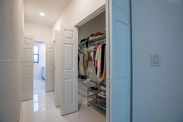 a bathroom with a sink mirror and window
