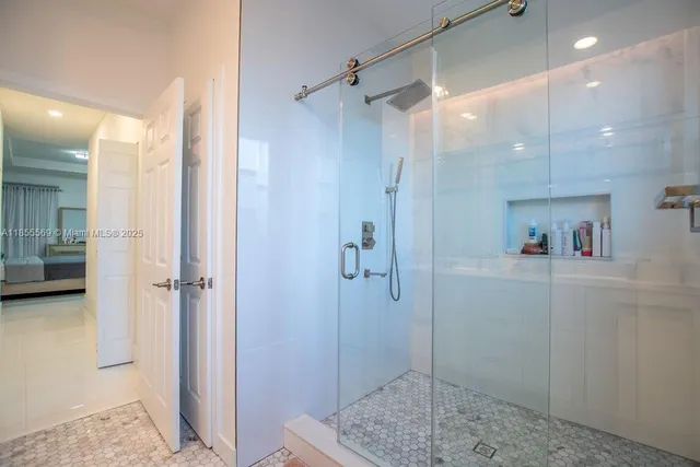 a white toilet sitting next to a bathroom sink