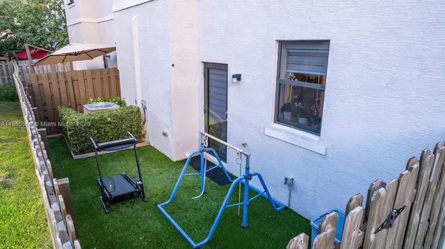 an aerial view of a house with a garden
