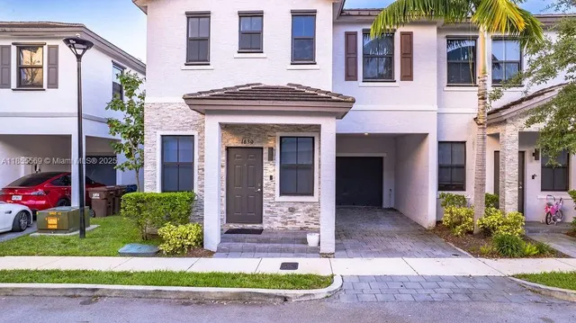 a view of an chairs and table in the balcony