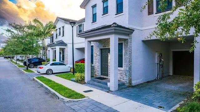 a view of a house with a yard porch and furniture
