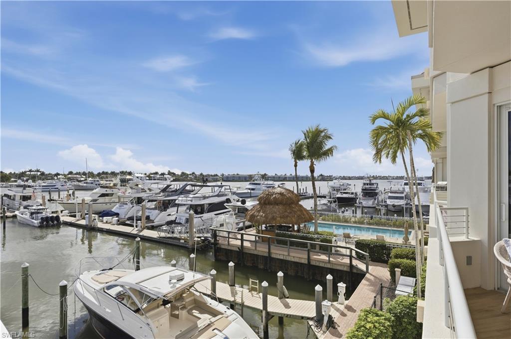 Dock area with a water view and a balcony