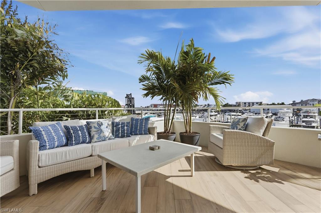909 10th Street South, Unit 201 Naples, FL 34102 - Photo 14 of 42 Deck featuring outdoor furniture