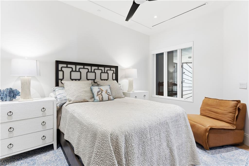 909 10th Street South, Unit 201 Naples, FL 34102 - Photo 16 of 42 Bedroom featuring ceiling fan